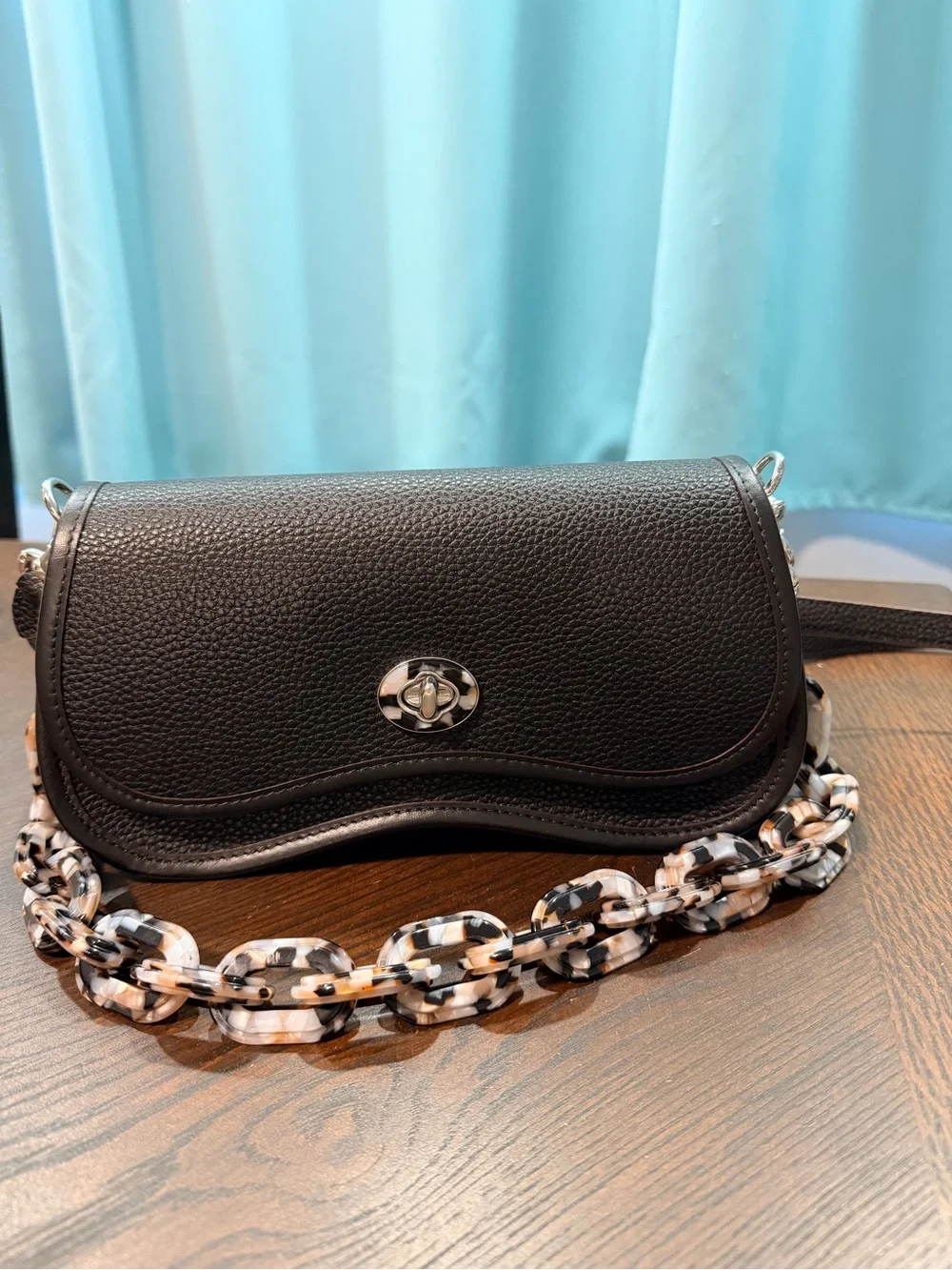 Coachtopia Wavy Dinkey black Pebble Leather Crossbody with acrylic chain.